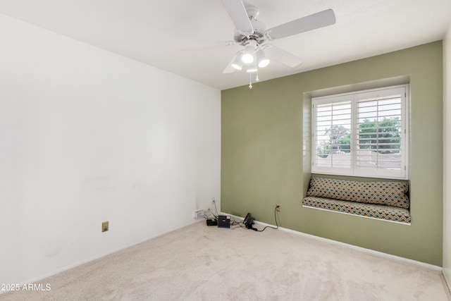 unfurnished room featuring a ceiling fan, carpet flooring, and baseboards