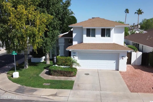 view of front of home with fence, concrete driveway, roof with shingles, stucco siding, and a garage