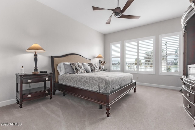 bedroom with multiple windows, carpet, and ceiling fan