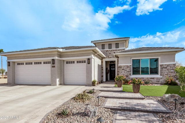 prairie-style home featuring a garage