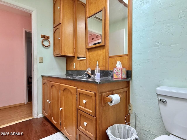 9495 E Marilyn Ln, Dewey, AZ 86327 - bathroom featuring wood finished floors, vanity, and toilet