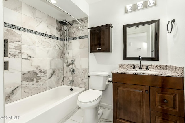 full bathroom with vanity, toilet, and tiled shower / bath combo