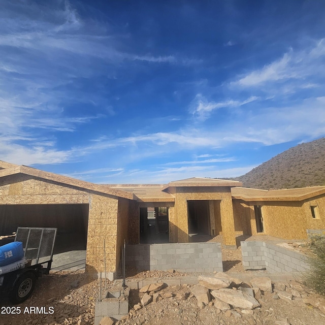 exterior space featuring a mountain view