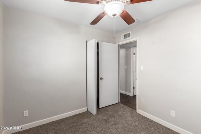 unfurnished bedroom with ceiling fan and carpet floors