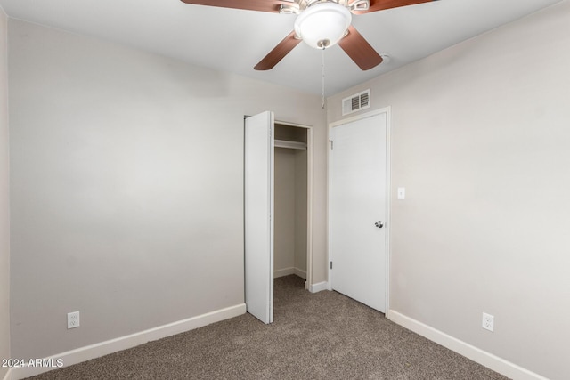 unfurnished bedroom featuring carpet, a closet, and ceiling fan