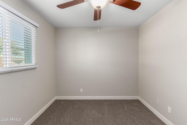 carpeted empty room featuring ceiling fan