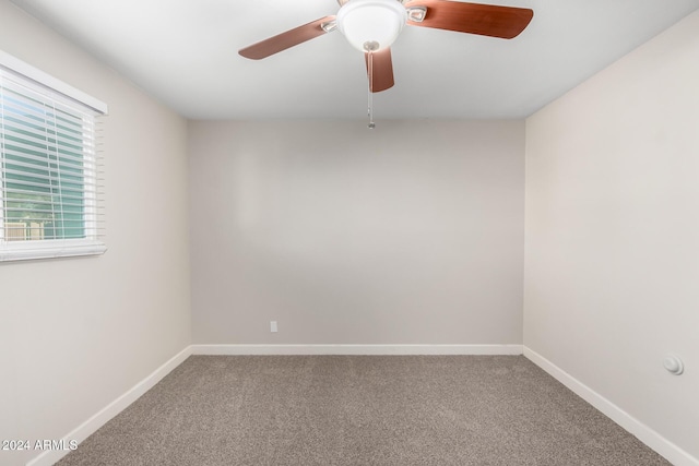 spare room with carpet flooring and ceiling fan