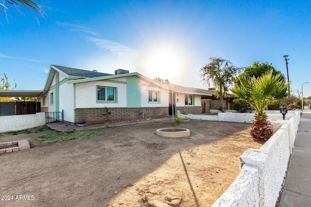 ranch-style house with a carport