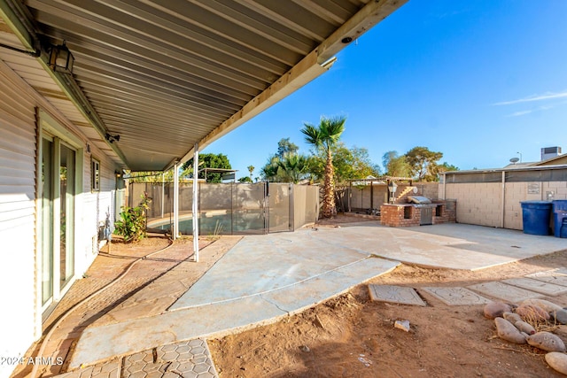 view of patio with an outdoor kitchen