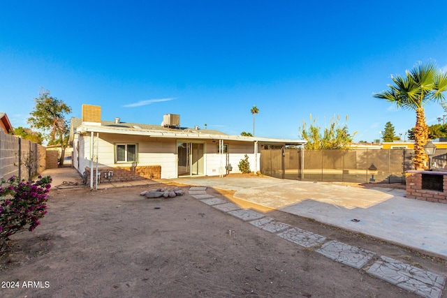 back of house with a patio and cooling unit