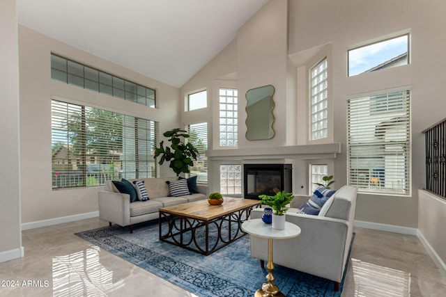 living room featuring high vaulted ceiling