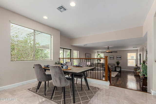 dining area with ceiling fan and hardwood / wood-style floors