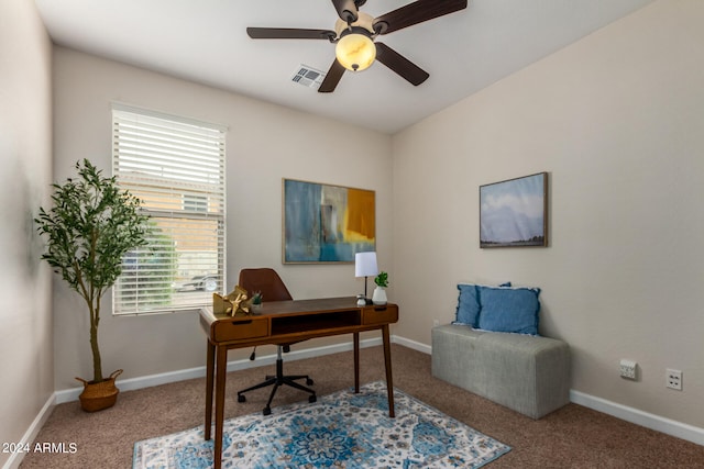 carpeted office featuring ceiling fan