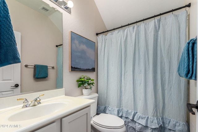 bathroom featuring a shower with curtain, vaulted ceiling, vanity, and toilet