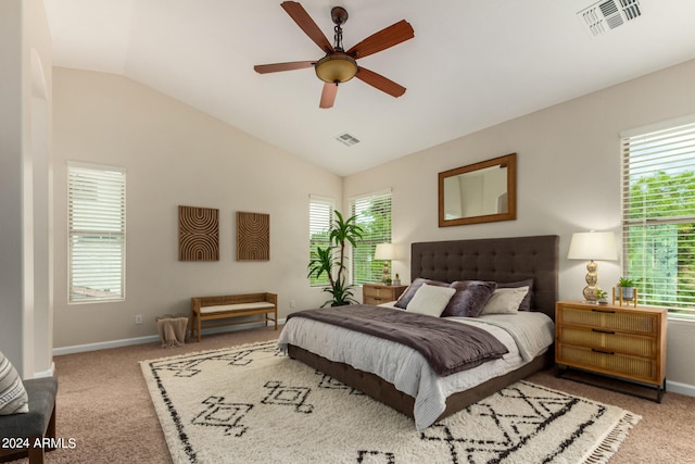 carpeted bedroom featuring ceiling fan, lofted ceiling, and multiple windows