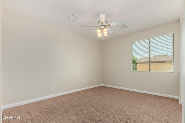 carpeted empty room featuring ceiling fan