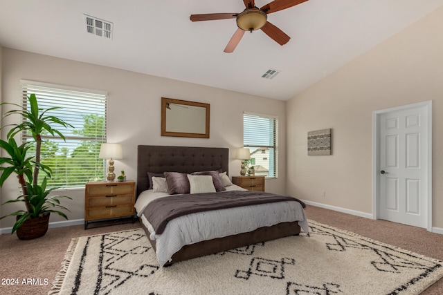 bedroom with ceiling fan, carpet flooring, and lofted ceiling