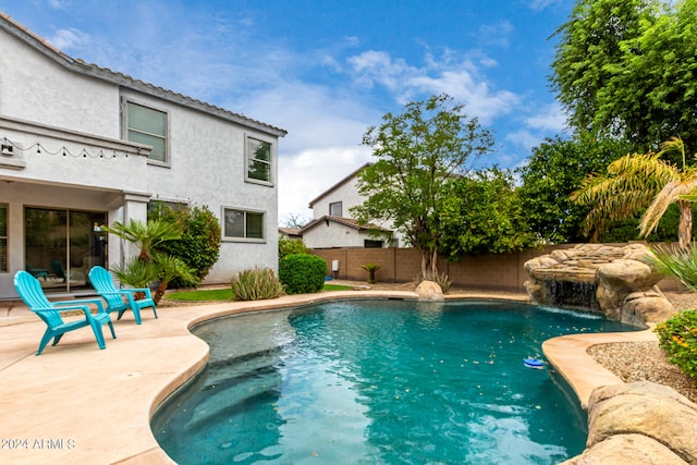 view of pool with pool water feature