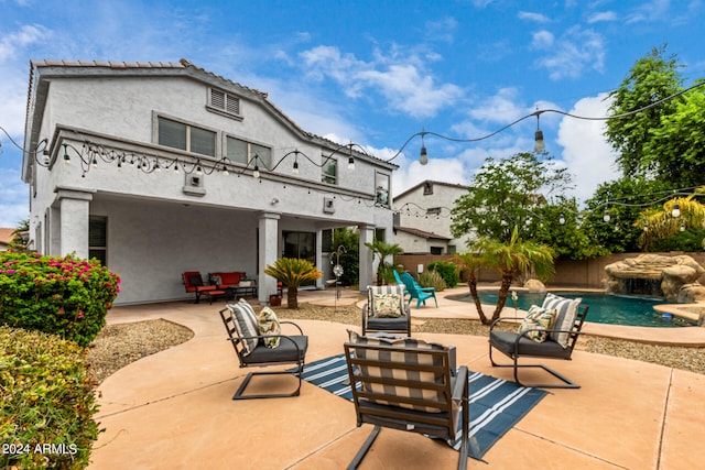 view of patio with pool water feature