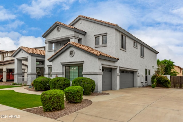 mediterranean / spanish-style house featuring a garage