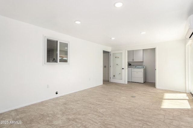 unfurnished living room with washer and dryer