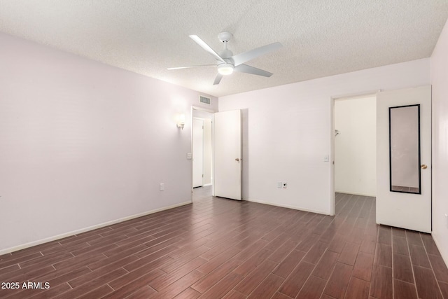 empty room featuring ceiling fan and a textured ceiling