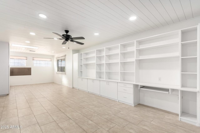 interior space featuring wood ceiling and ceiling fan