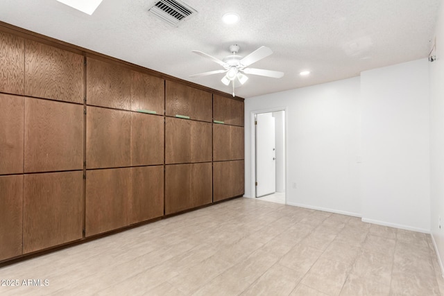 unfurnished bedroom featuring a textured ceiling, a closet, and ceiling fan