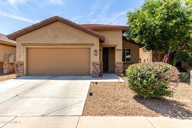 7015 W Melody Dr, Laveen, AZ 85339 - view of front of property featuring stone siding, a garage, driveway, and stucco siding