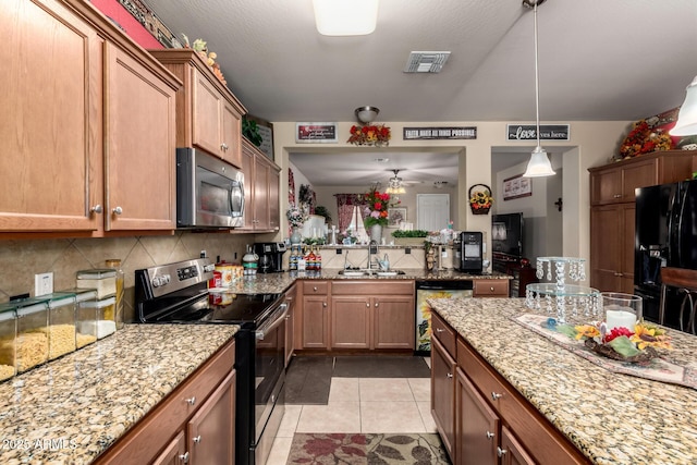 7015 W Melody Dr, Laveen, AZ 85339 - kitchen featuring stainless steel appliances, a sink, backsplash, and light stone counters
