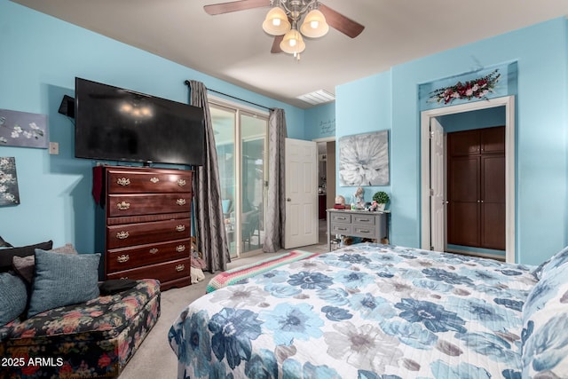 7015 W Melody Dr, Laveen, AZ 85339 - carpeted bedroom with a ceiling fan and access to outside