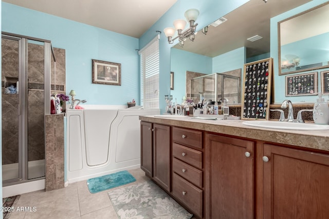 7015 W Melody Dr, Laveen, AZ 85339 - bathroom featuring a stall shower, tile patterned floors, a garden tub, and double vanity