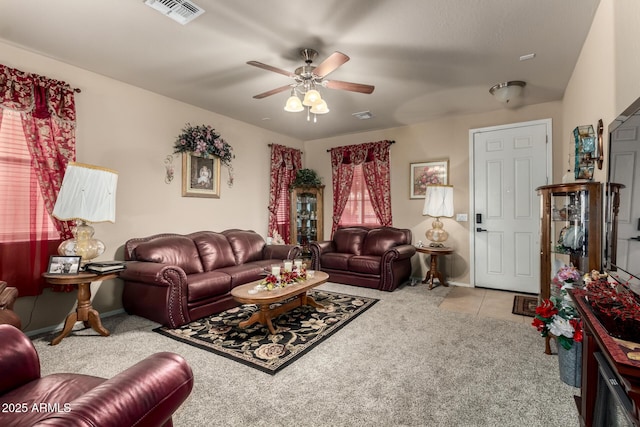 7015 W Melody Dr, Laveen, AZ 85339 - carpeted living room featuring ceiling fan and tile patterned floors