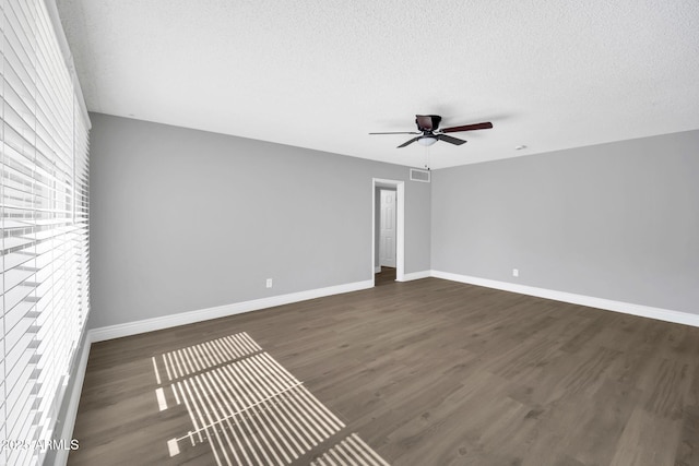 7039 N 15th St, Phoenix, AZ 85020 - unfurnished room featuring visible vents, baseboards, a ceiling fan, and wood finished floors
