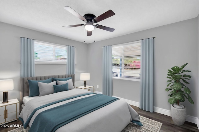 7039 N 15th St, Phoenix, AZ 85020 - bedroom with baseboards, a ceiling fan, and wood finished floors