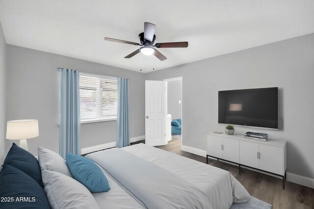 7039 N 15th St, Phoenix, AZ 85020 - bedroom with baseboards, a ceiling fan, and wood finished floors