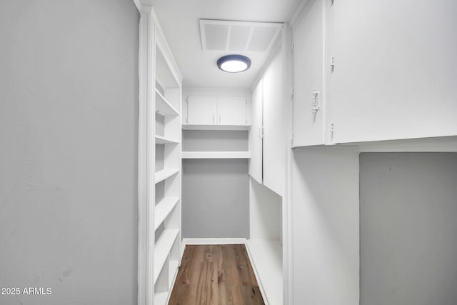 7039 N 15th St, Phoenix, AZ 85020 - spacious closet featuring dark wood finished floors and visible vents