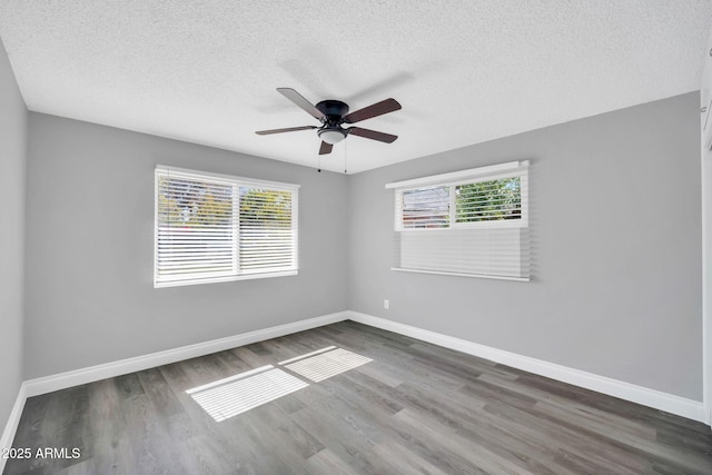 7039 N 15th St, Phoenix, AZ 85020 - spare room featuring ceiling fan, baseboards, wood finished floors, and a textured ceiling