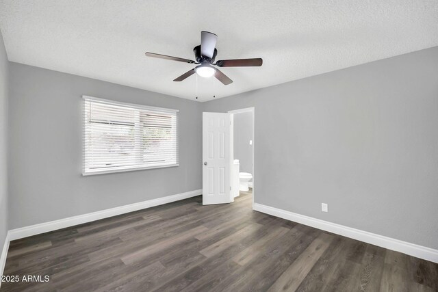 7039 N 15th St, Phoenix, AZ 85020 - unfurnished bedroom featuring ceiling fan, baseboards, and wood finished floors