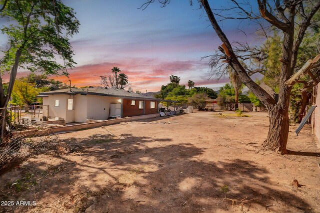 7039 N 15th St, Phoenix, AZ 85020 - exterior space featuring stucco siding and fence