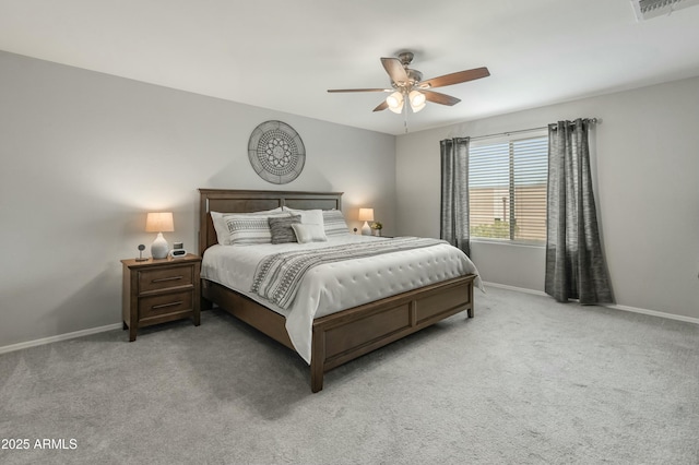 bedroom with carpet floors, visible vents, ceiling fan, and baseboards