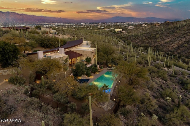 aerial view at dusk with a mountain view