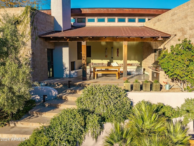 back of house featuring an outdoor hangout area and a patio area