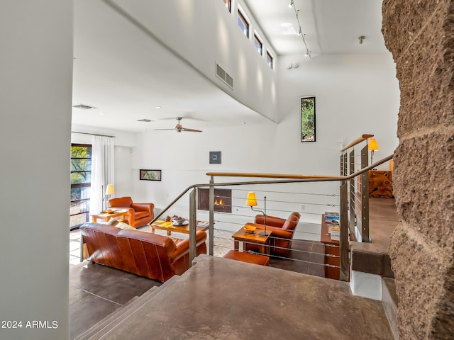 interior space featuring track lighting and ceiling fan