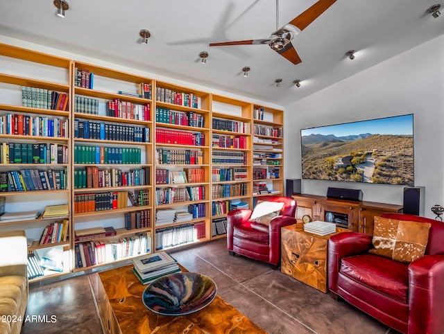 living area with vaulted ceiling and ceiling fan