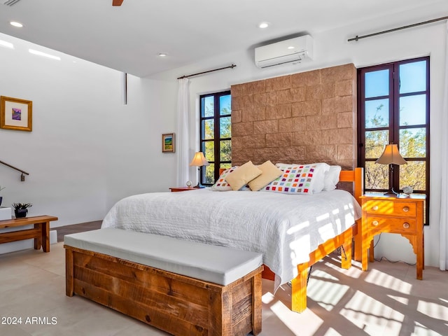 bedroom featuring a wall mounted AC