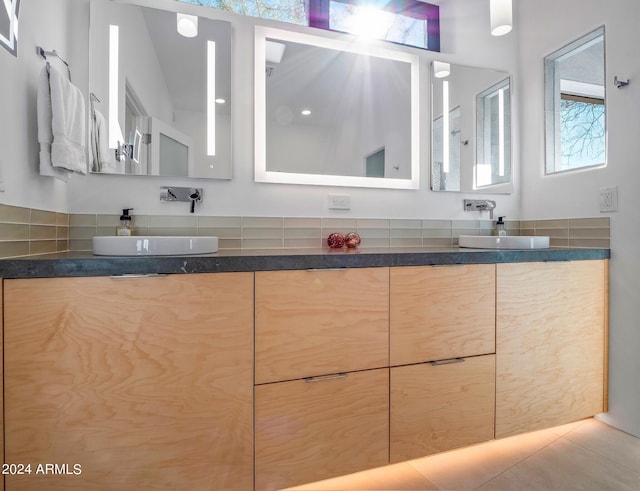 bathroom with tile patterned flooring and vanity