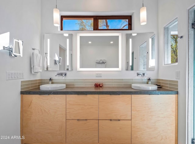 bathroom featuring plenty of natural light and vanity