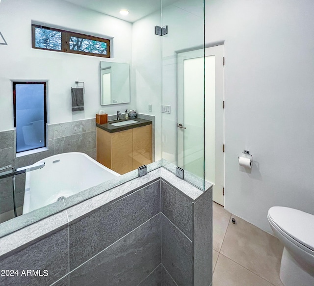 bathroom featuring tile patterned floors, vanity, and toilet