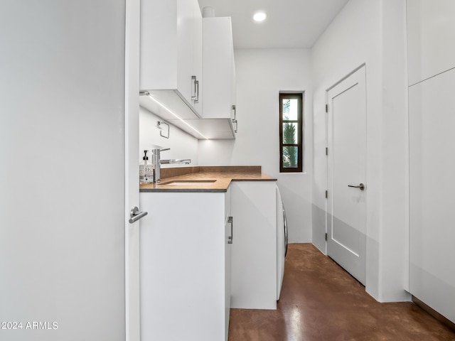 washroom with cabinets and sink